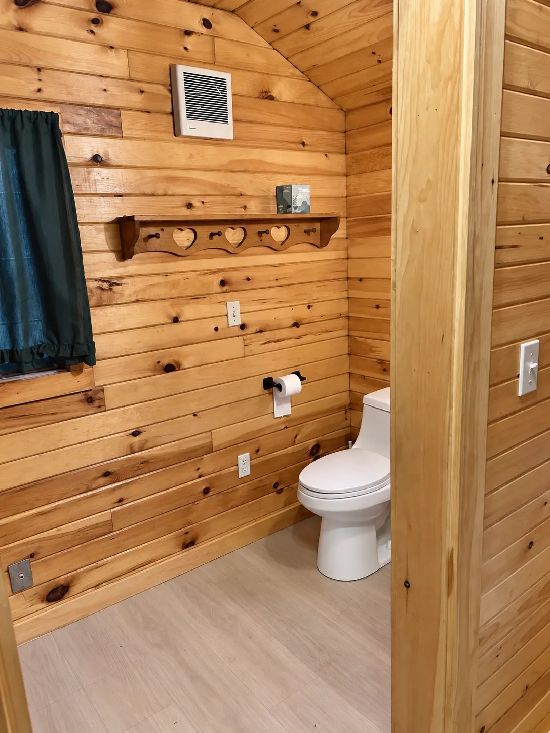 Restroom finished in pine with towel hooks
